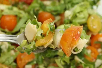 Voir cette recette Salade de tomates cerises, salade verte et copeaux de parmesan